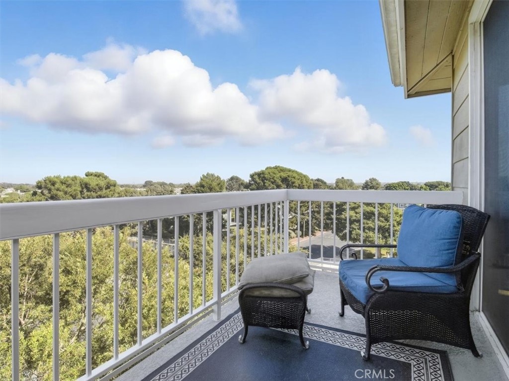 20331 Bluffside Circle, Unit A411 Huntington Beach, CA 92646 - Photo 26 of 44 a view of roof deck with two chairs and a potted plant