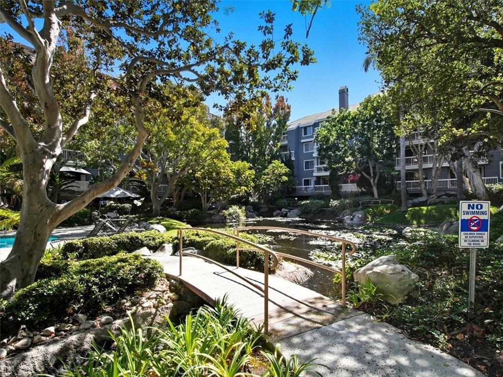 20331 Bluffside Circle, Unit A411 Huntington Beach, CA 92646 - Photo 39 of 44 a view of a house with a yard