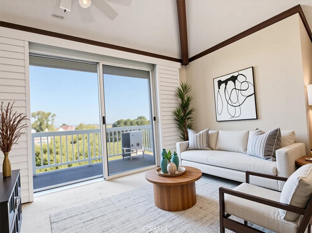 20331 Bluffside Circle, Unit A411 Huntington Beach, CA 92646 - Photo 5 of 44 a living room with furniture and a potted plant