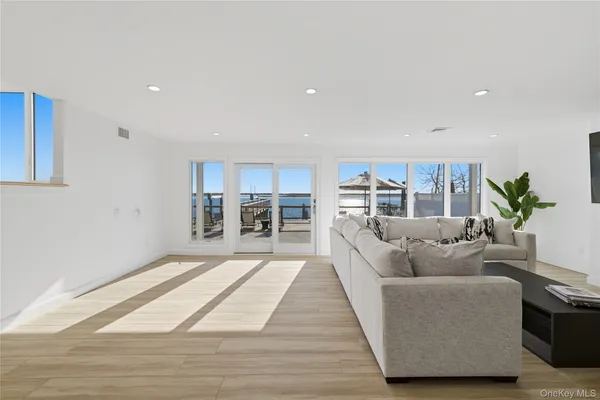 a living room with furniture and a rug