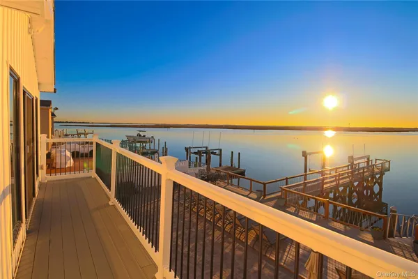 a view of a balcony with an ocean view
