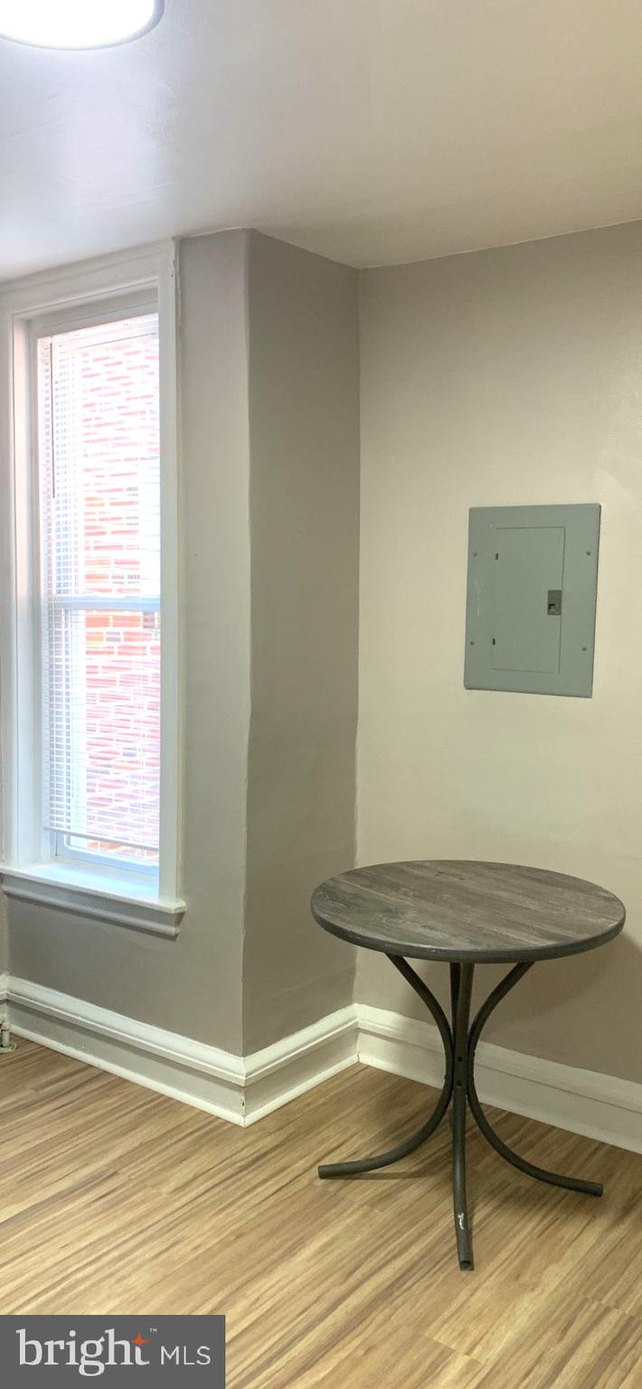 252 Rosemar Street, Unit 2 Philadelphia, PA 19120 - Photo 14 of 22 a view of a room with furniture and wooden floor