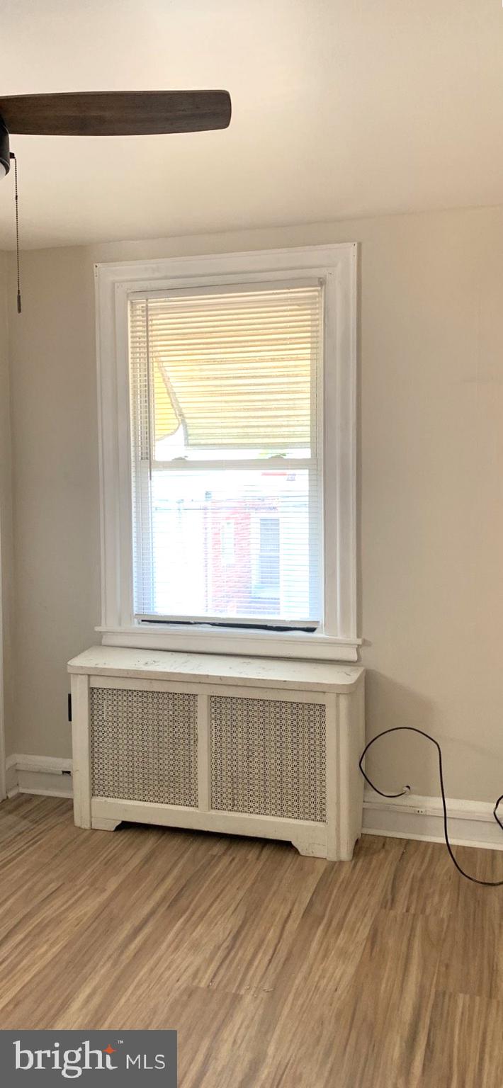 252 Rosemar Street, Unit 2 Philadelphia, PA 19120 - Photo 16 of 22 a view of an empty room with a window