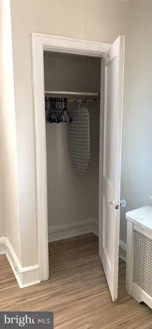 wooden floor in a white room