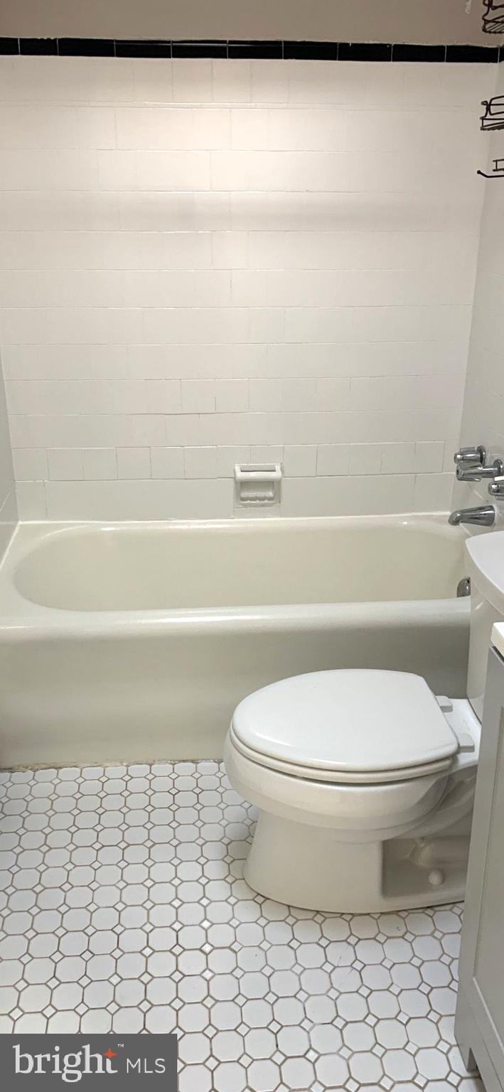 252 Rosemar Street, Unit 2 Philadelphia, PA 19120 - Photo 19 of 22 a bathroom with a toilet and a bathtub