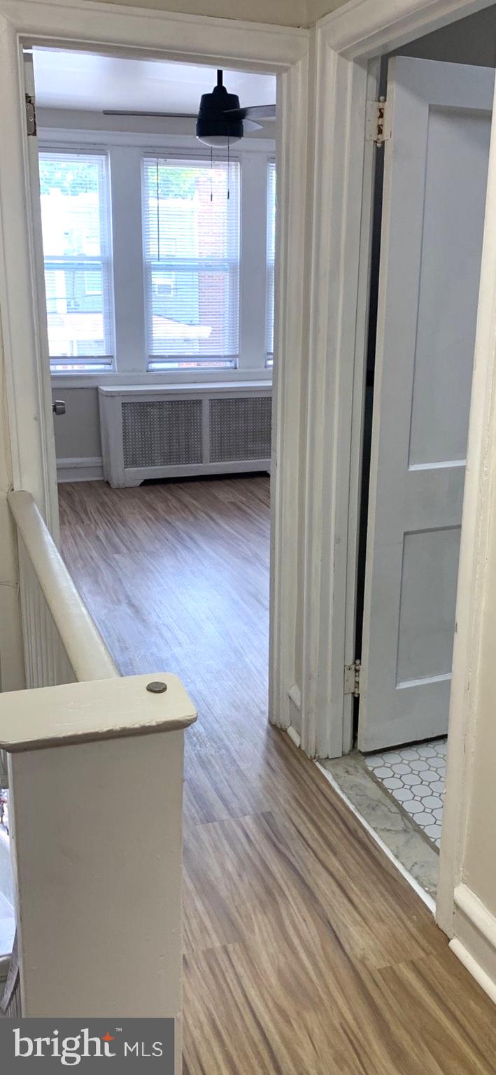 252 Rosemar Street, Unit 2 Philadelphia, PA 19120 - Photo 3 of 22 a view of front door with wooden floor