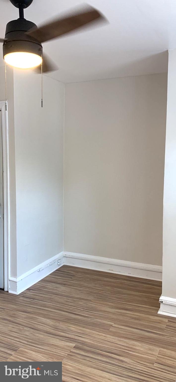 252 Rosemar Street, Unit 2 Philadelphia, PA 19120 - Photo 7 of 22 a view of a room with wooden floor