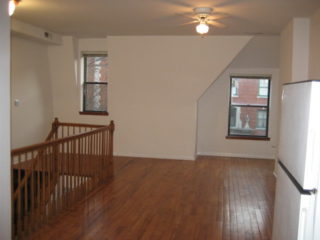 Undisclosed Address Chicago, IL 60607 - Photo 3 of 8 a view of livingroom with hardwood floor and hallway