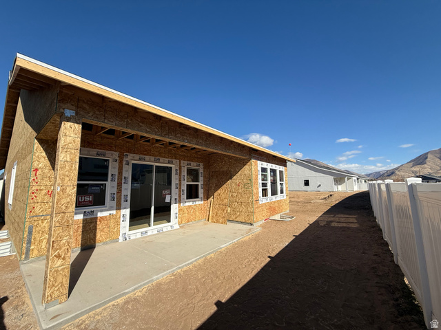 2227 Fortune Lane, Unit 448 Mapleton, UT 84664 - Photo 3 of 4 Rear view of house with a mountain view and a patio