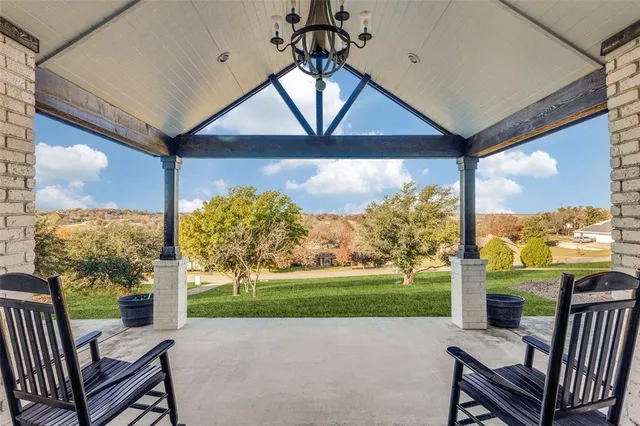 a living room with fireplace furniture and a flat screen tv
