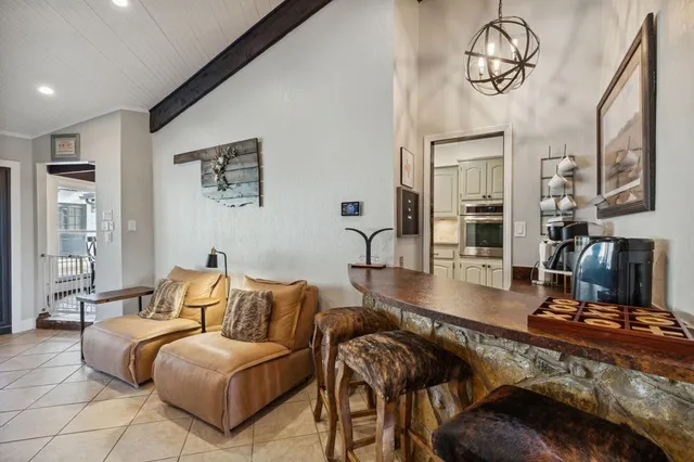 a kitchen with cabinets and a stove
