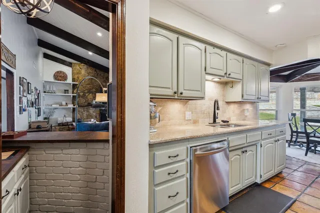 a dining room with furniture a chandelier and wooden floor