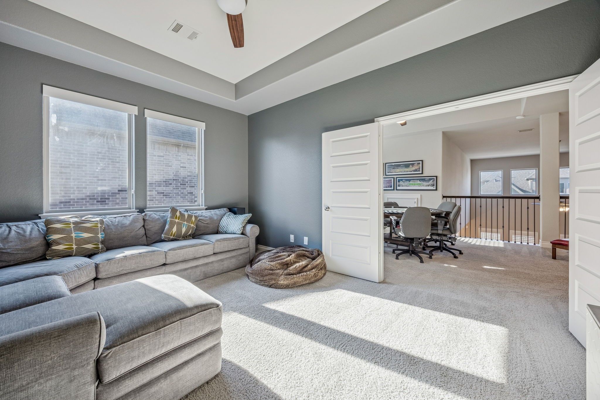 28706 Casen Ranch Lane Fulshear, TX 77441 - Photo 18 of 31 The dedicated media room is designed for ultimate movie experiences with dark grey walls, tray ceilings and large windows. This private cinema space adds incredible entertainment value to the home.