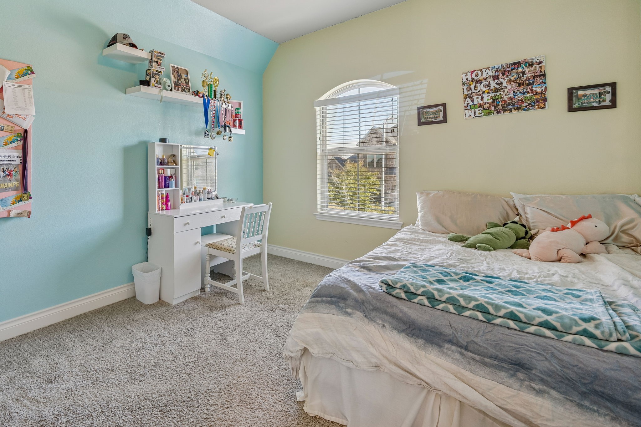 28706 Casen Ranch Lane Fulshear, TX 77441 - Photo 19 of 31 This bright secondary bedroom features a unique arched window and vibrant accent wall.