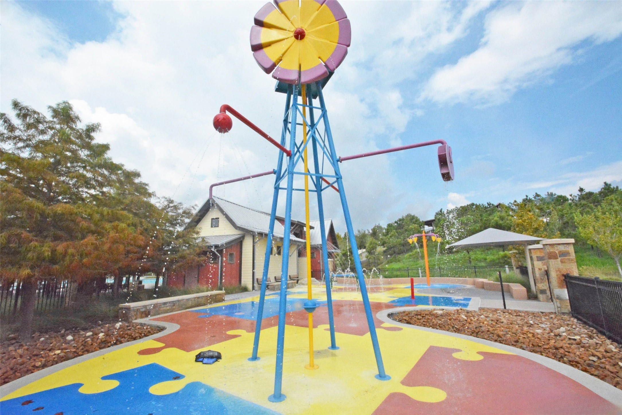 28706 Casen Ranch Lane Fulshear, TX 77441 - Photo 30 of 31 The water play area at Adventure Island in Cross Creek Ranch offers a fun, interactive splash zone designed for younger residents, complete with colorful spray features and shaded seating—one of many family-friendly amenities that make this master-planned community such a desirable place to call home.