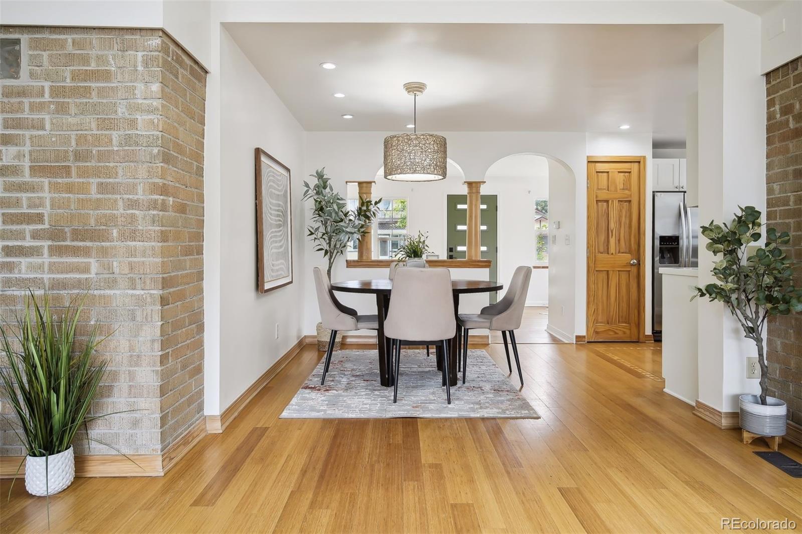 2675 Raleigh Street Denver, CO 80212 - Photo 15 of 33 a view of a dining room with furniture and wooden floor
