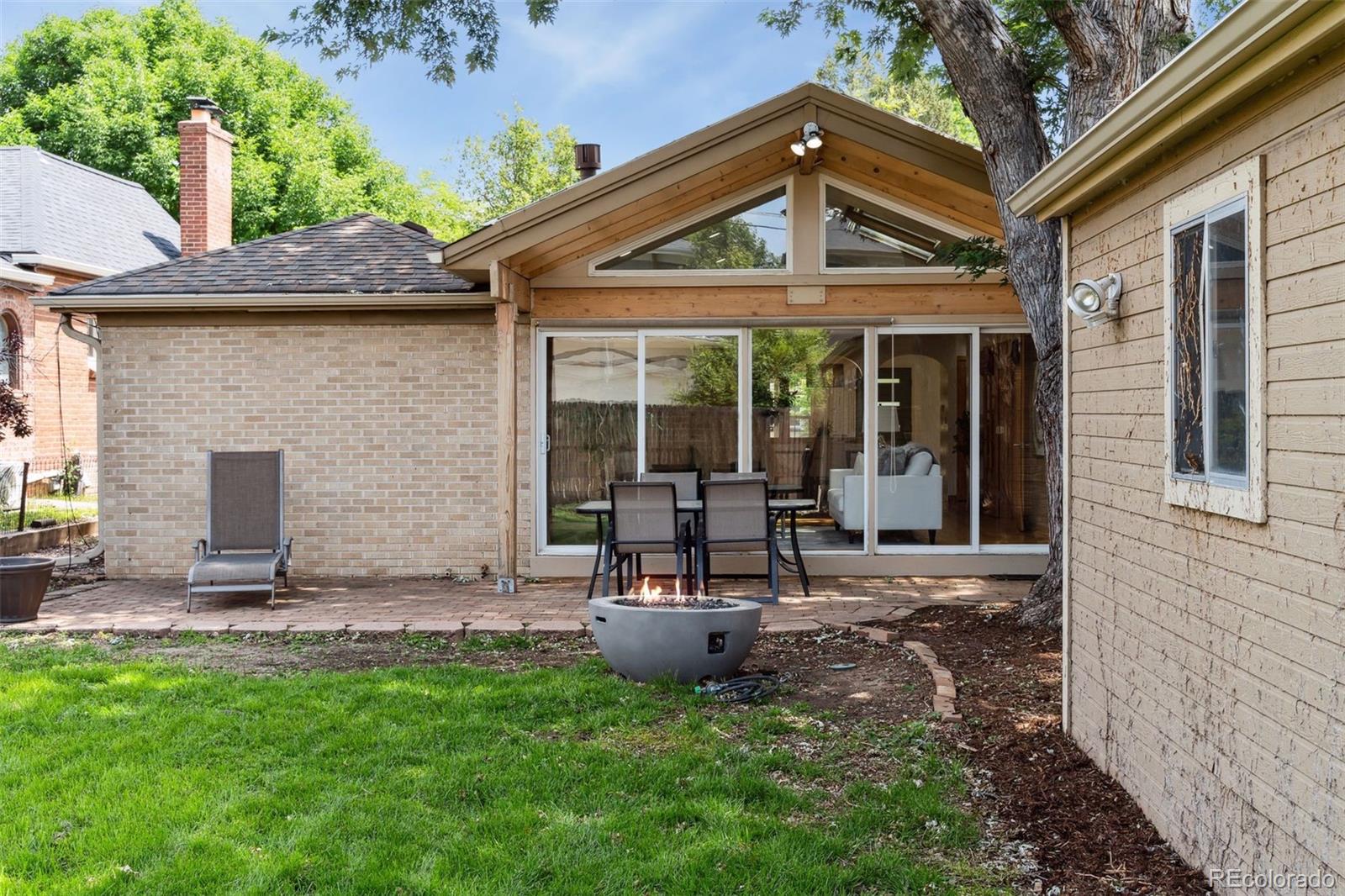2675 Raleigh Street Denver, CO 80212 - Photo 26 of 33 a view of a chair and table in backyard of the house