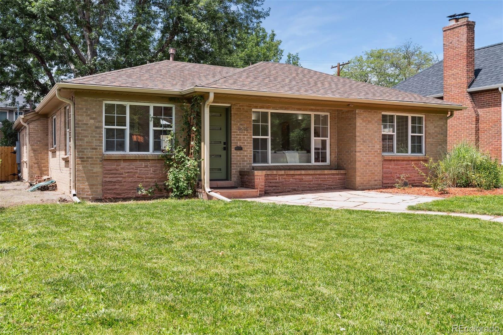 2675 Raleigh Street Denver, CO 80212 - Photo 3 of 33 a front view of a house with a garden