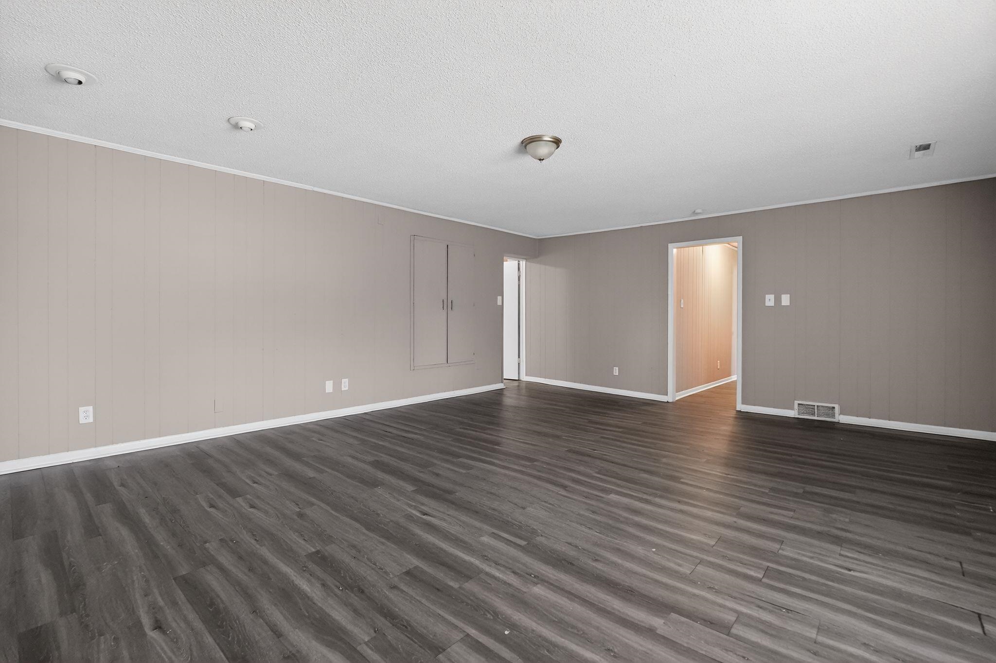 3220 Christine Road Memphis, TN 38118 - Photo 13 of 35 a view of an empty room with wooden floor