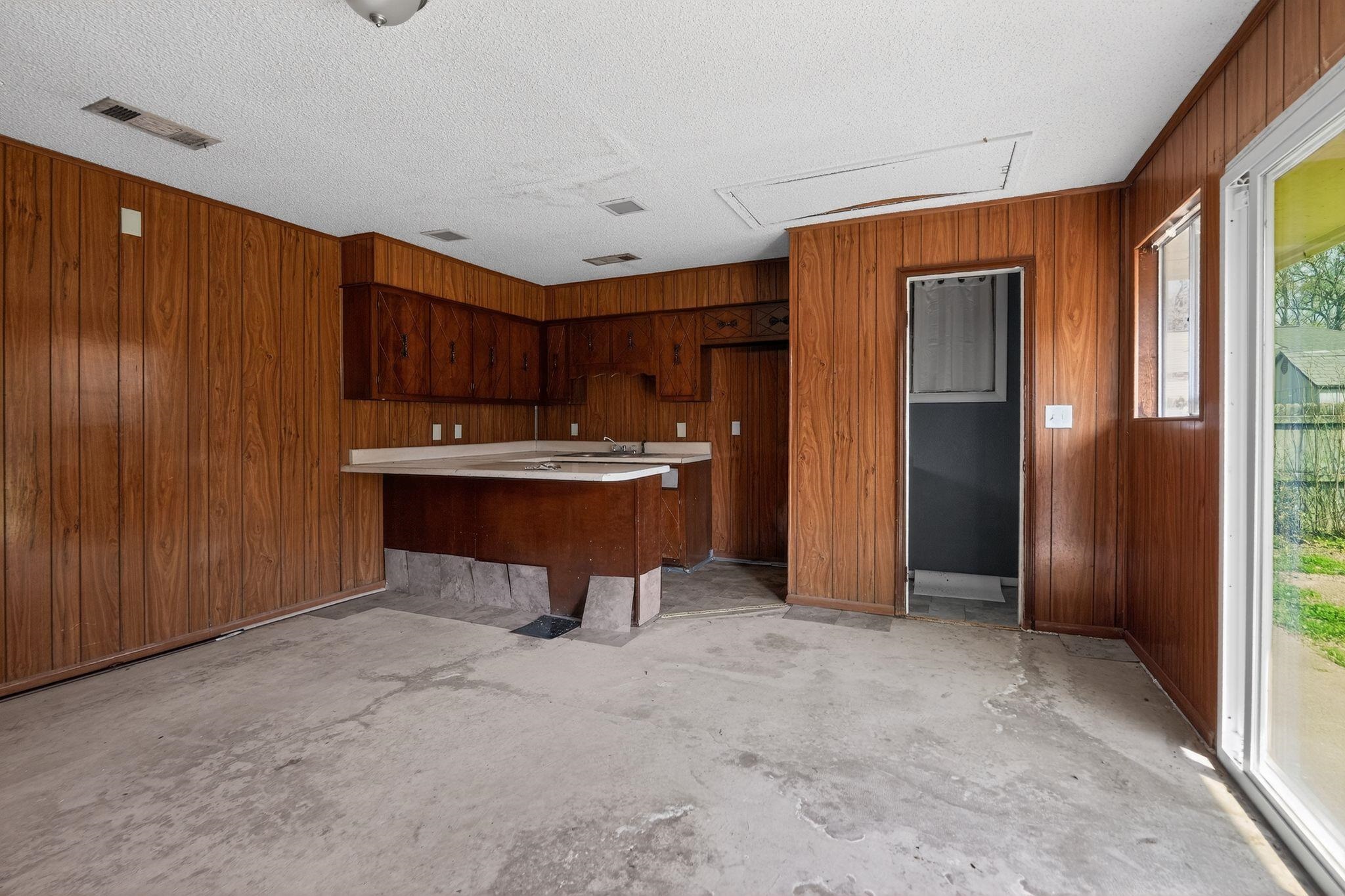 3220 Christine Road Memphis, TN 38118 - Photo 24 of 35 a room with kitchen island a sink a counter and a window
