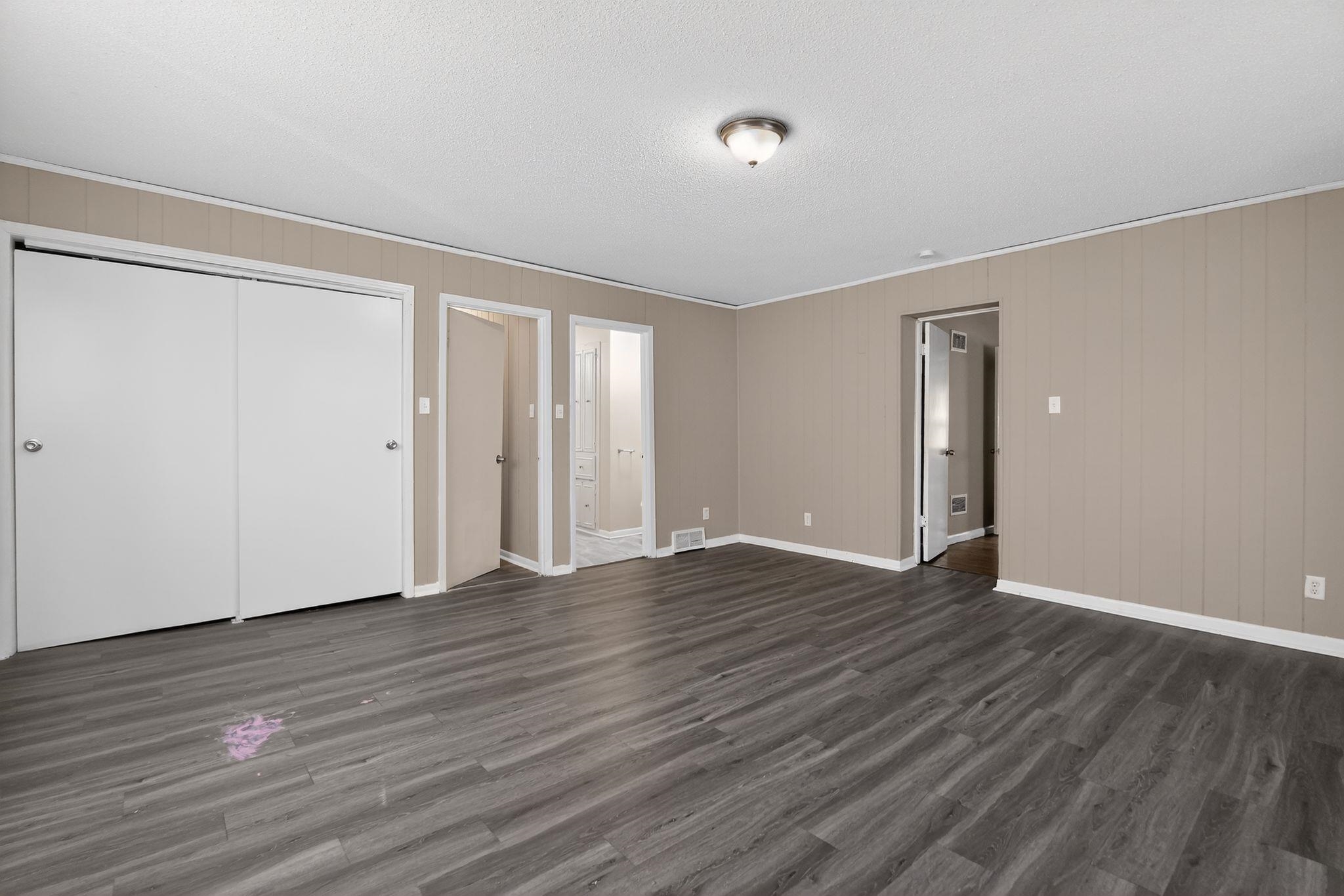 3220 Christine Road Memphis, TN 38118 - Photo 27 of 35 a view of an empty room with wooden floor and a window