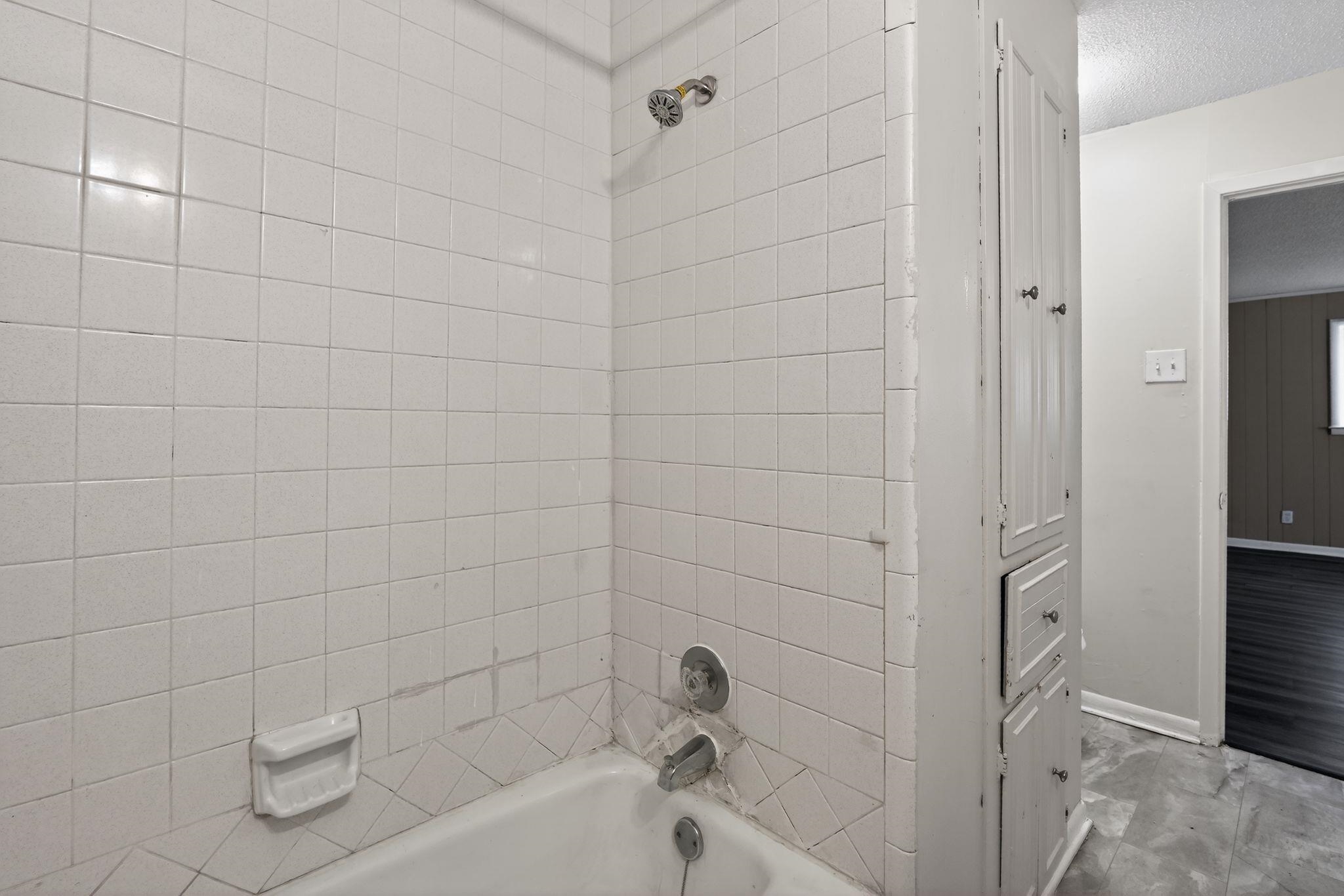 3220 Christine Road Memphis, TN 38118 - Photo 32 of 35 a bathroom with a bathtub and shower