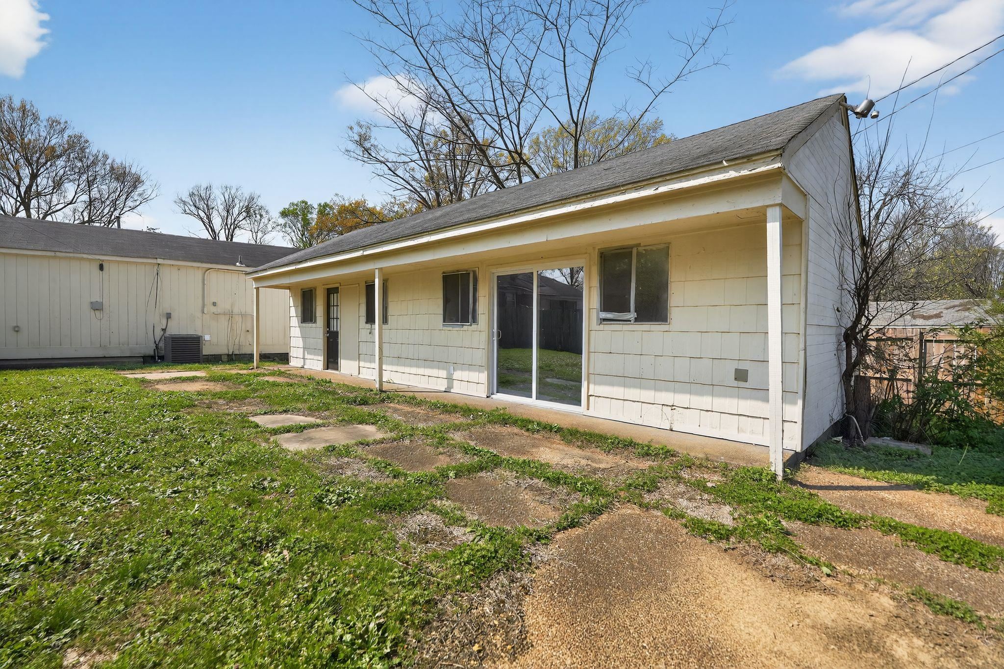 3220 Christine Road Memphis, TN 38118 - Photo 4 of 35 a view of a white house with a large window and yard