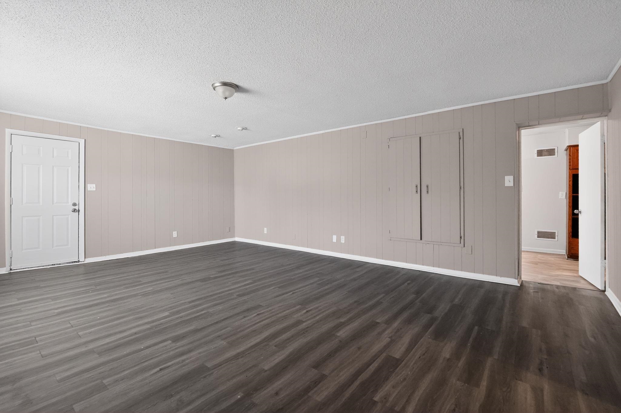 3220 Christine Road Memphis, TN 38118 - Photo 10 of 35 a view of an empty room with wooden floor