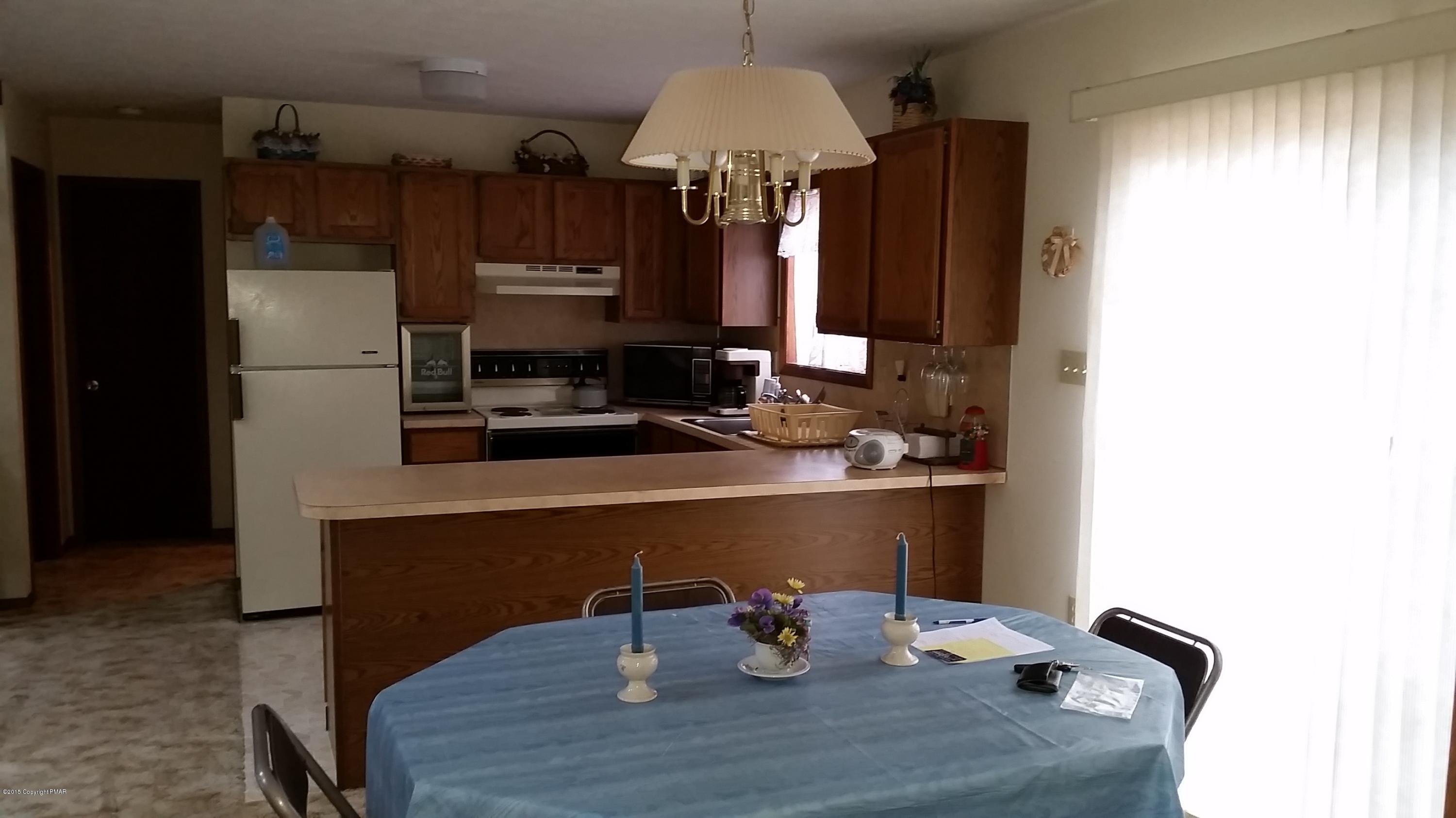 195 Gold Finch Road Bushkill, PA 18324 - Photo 10 of 14 a room with a table chairs and entryway