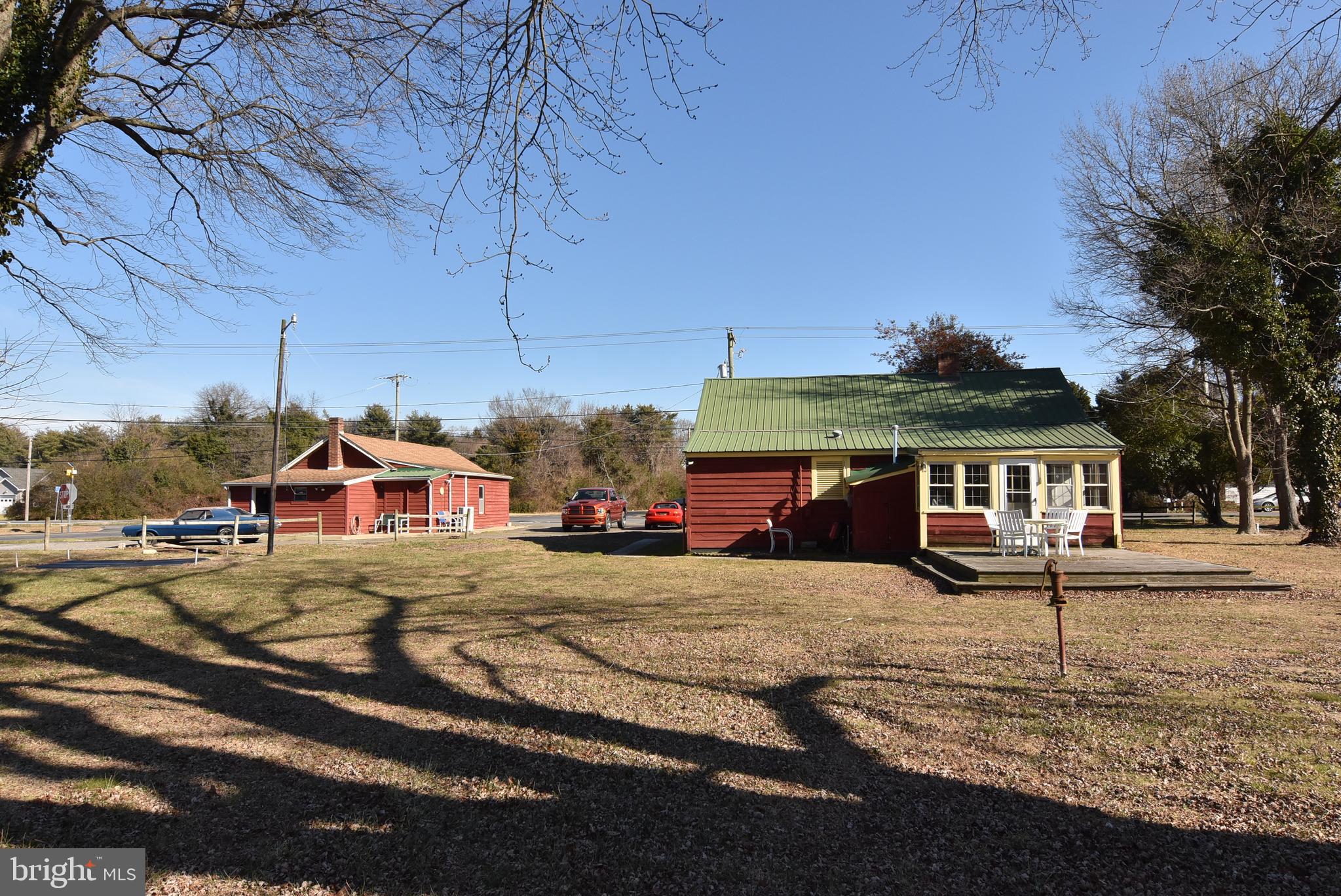 28740 Seaford Road Laurel, DE 19956 - Photo 19 of 44 a front view of a house with a yard and garage