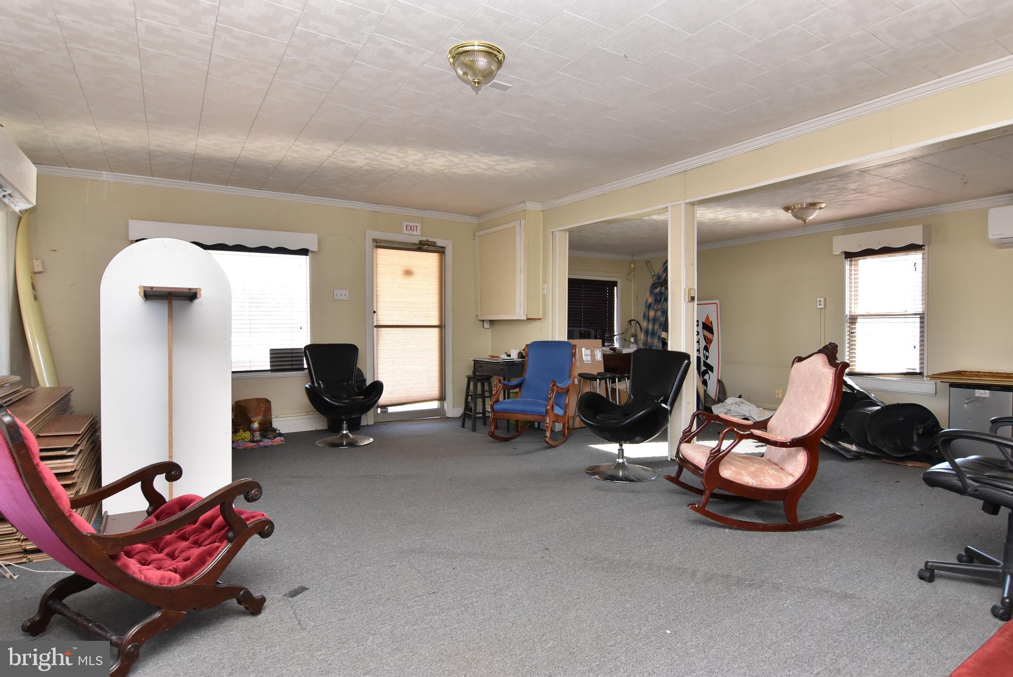 28740 Seaford Road Laurel, DE 19956 - Photo 20 of 44 a living room with furniture a window and gym equipment