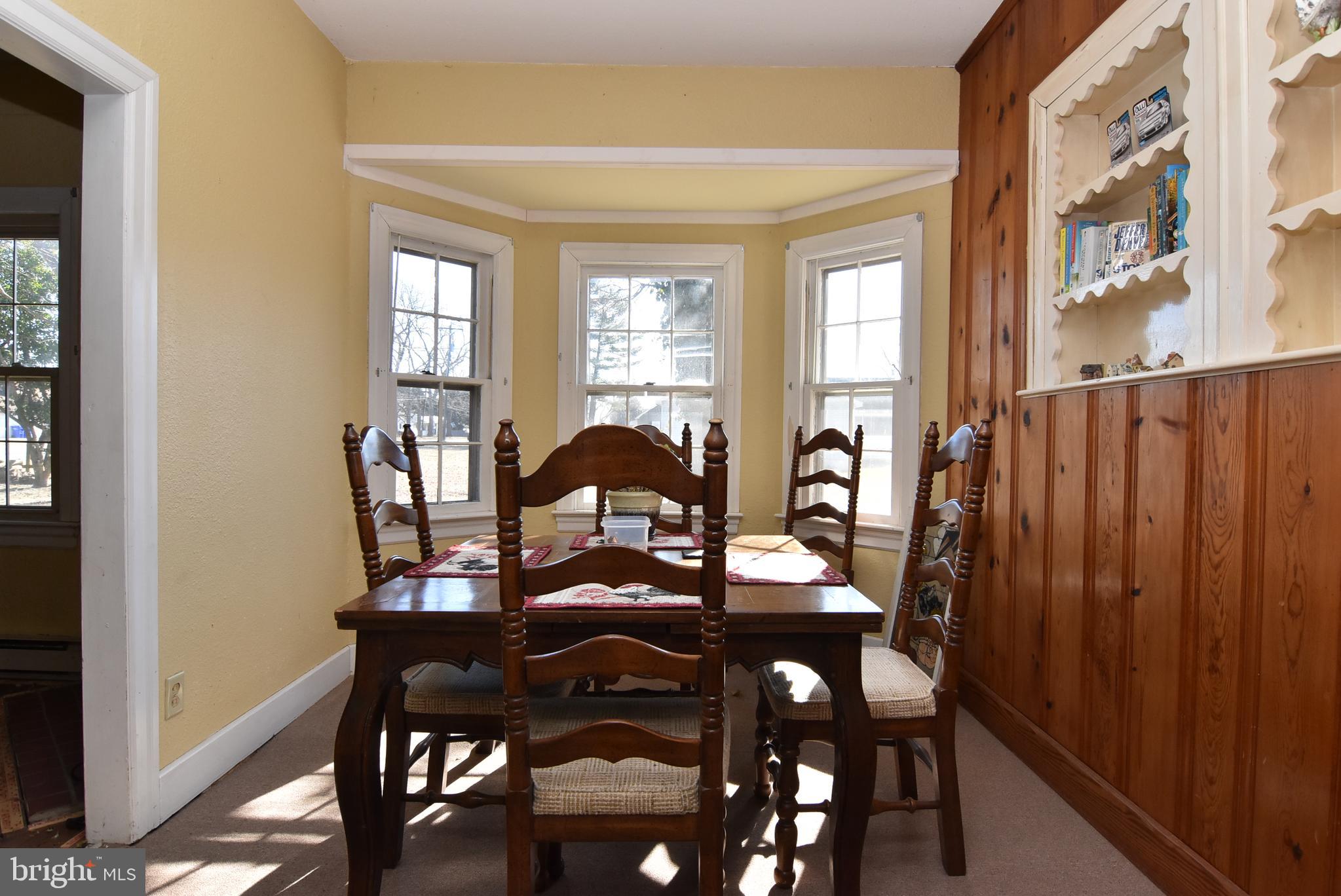 28740 Seaford Road Laurel, DE 19956 - Photo 26 of 44 a view of a a dining room with furniture window and wooden floor