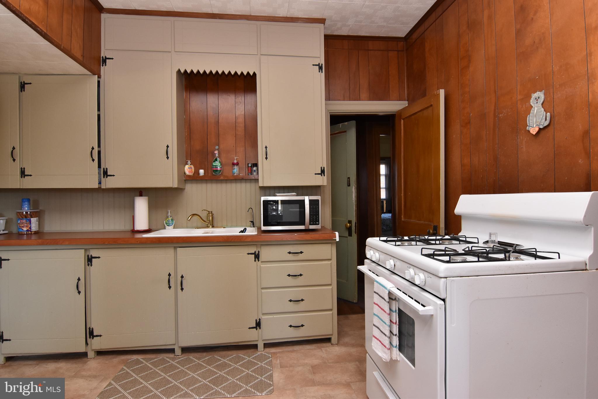 28740 Seaford Road Laurel, DE 19956 - Photo 29 of 44 a kitchen with granite countertop a sink cabinets and stainless steel appliances