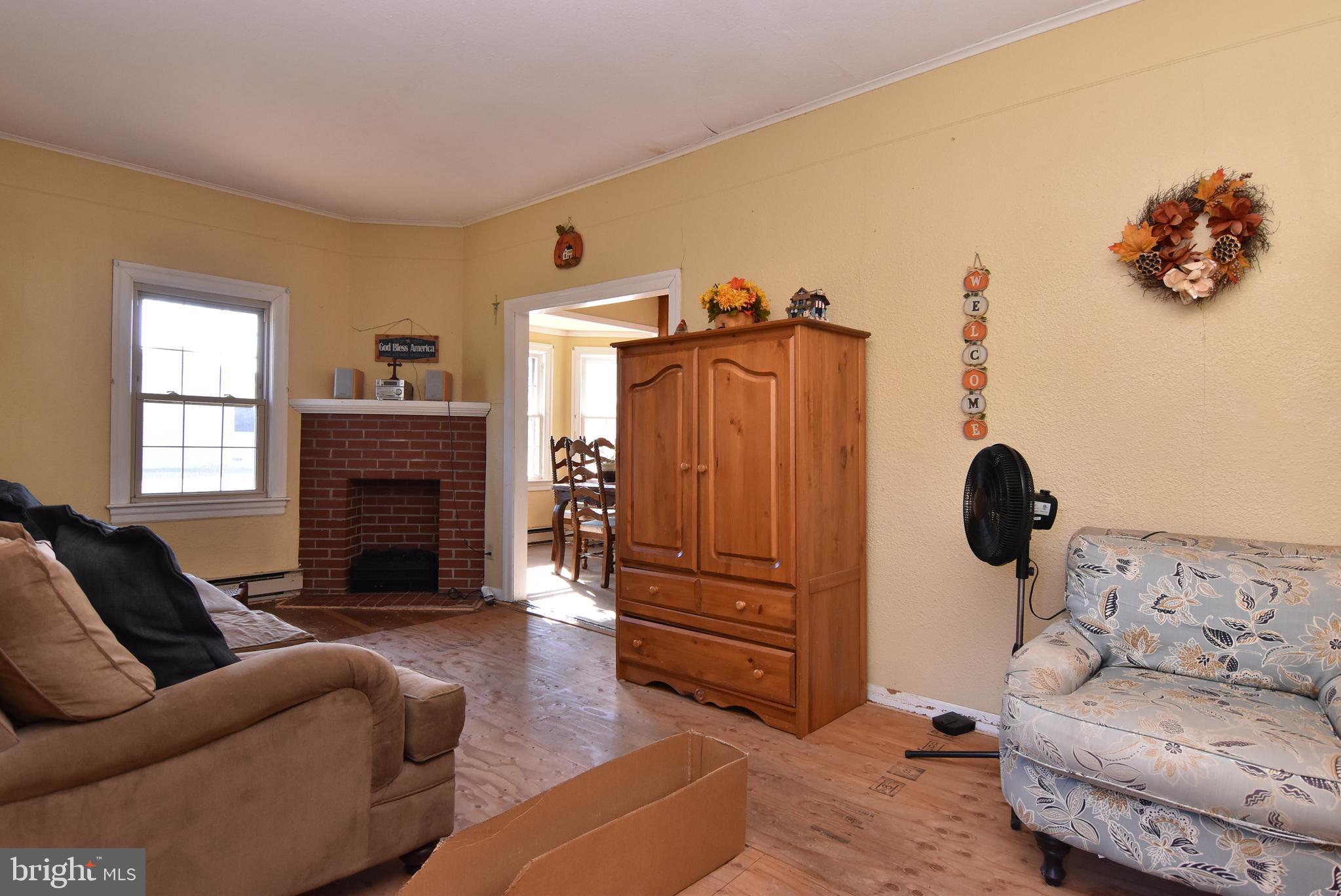 28740 Seaford Road Laurel, DE 19956 - Photo 34 of 44 a living room with furniture and a fireplace