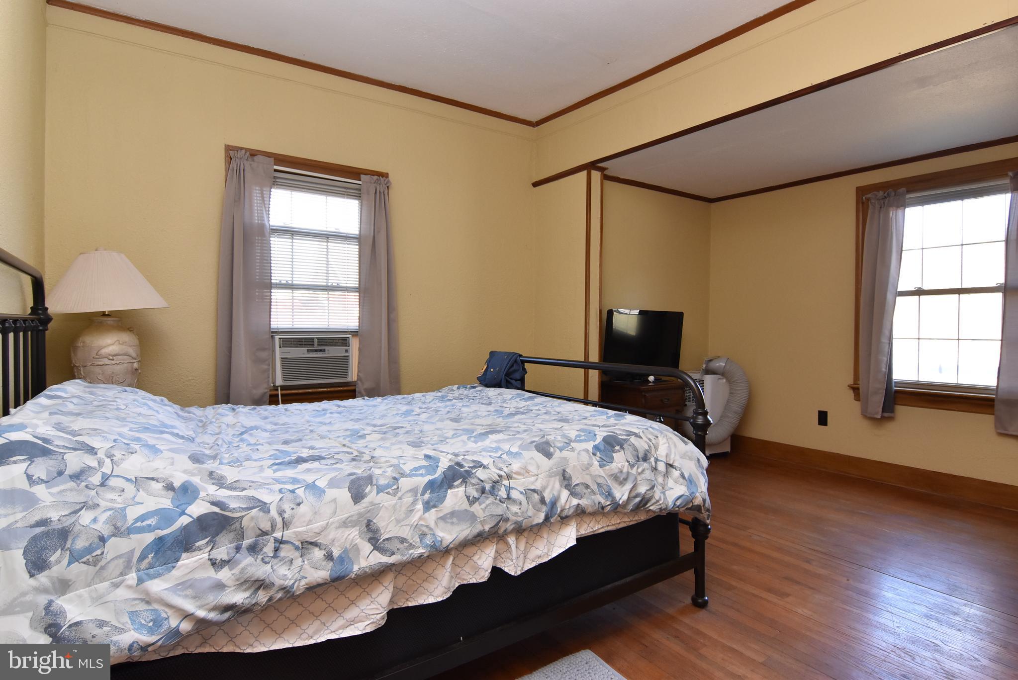 28740 Seaford Road Laurel, DE 19956 - Photo 37 of 44 a bedroom with a bed and wooden floor