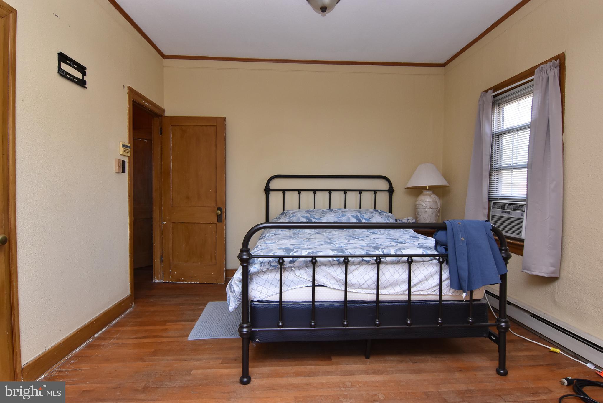 28740 Seaford Road Laurel, DE 19956 - Photo 39 of 44 a bedroom with a bed window and a table