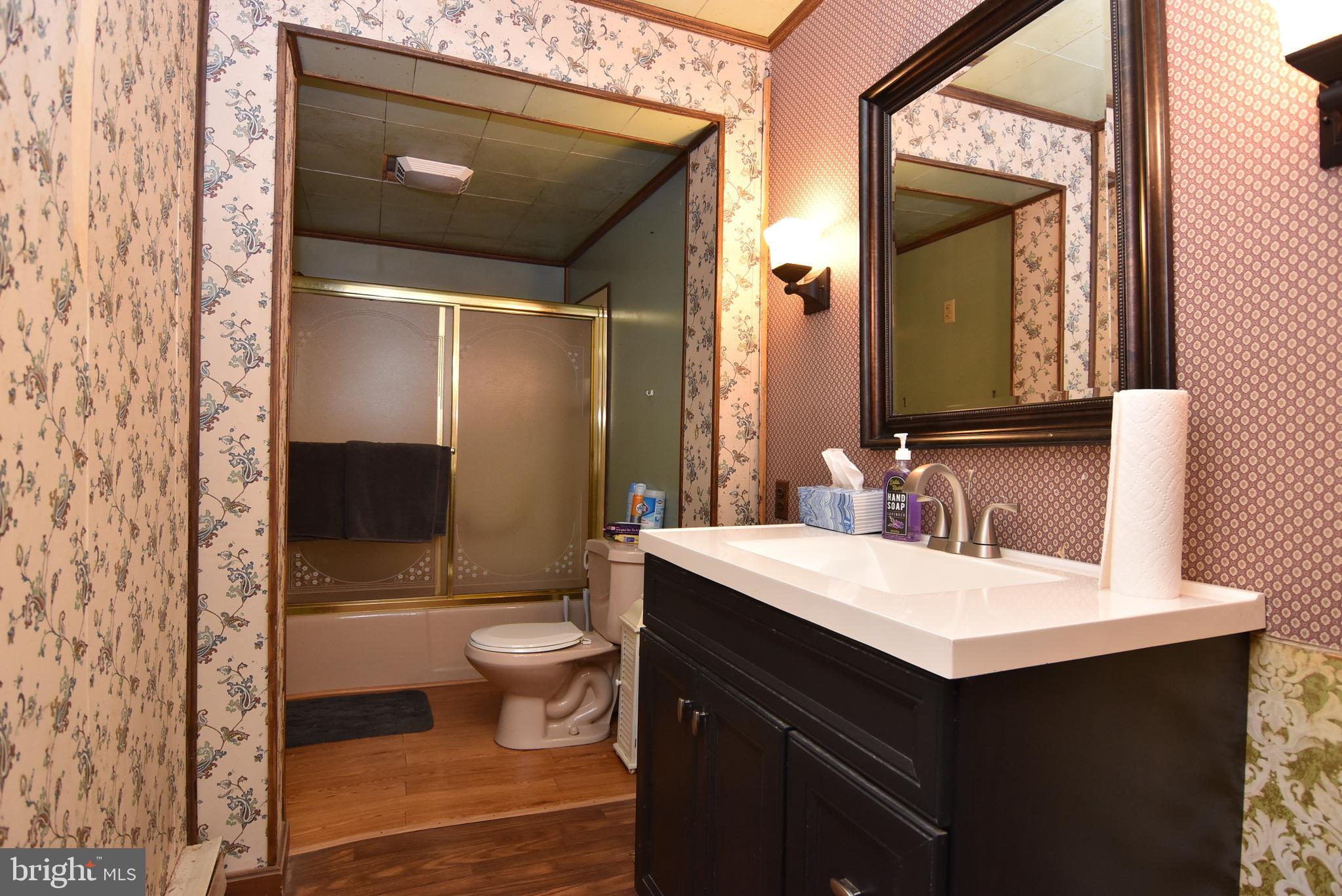 28740 Seaford Road Laurel, DE 19956 - Photo 41 of 44 a bathroom with a sink and a mirror