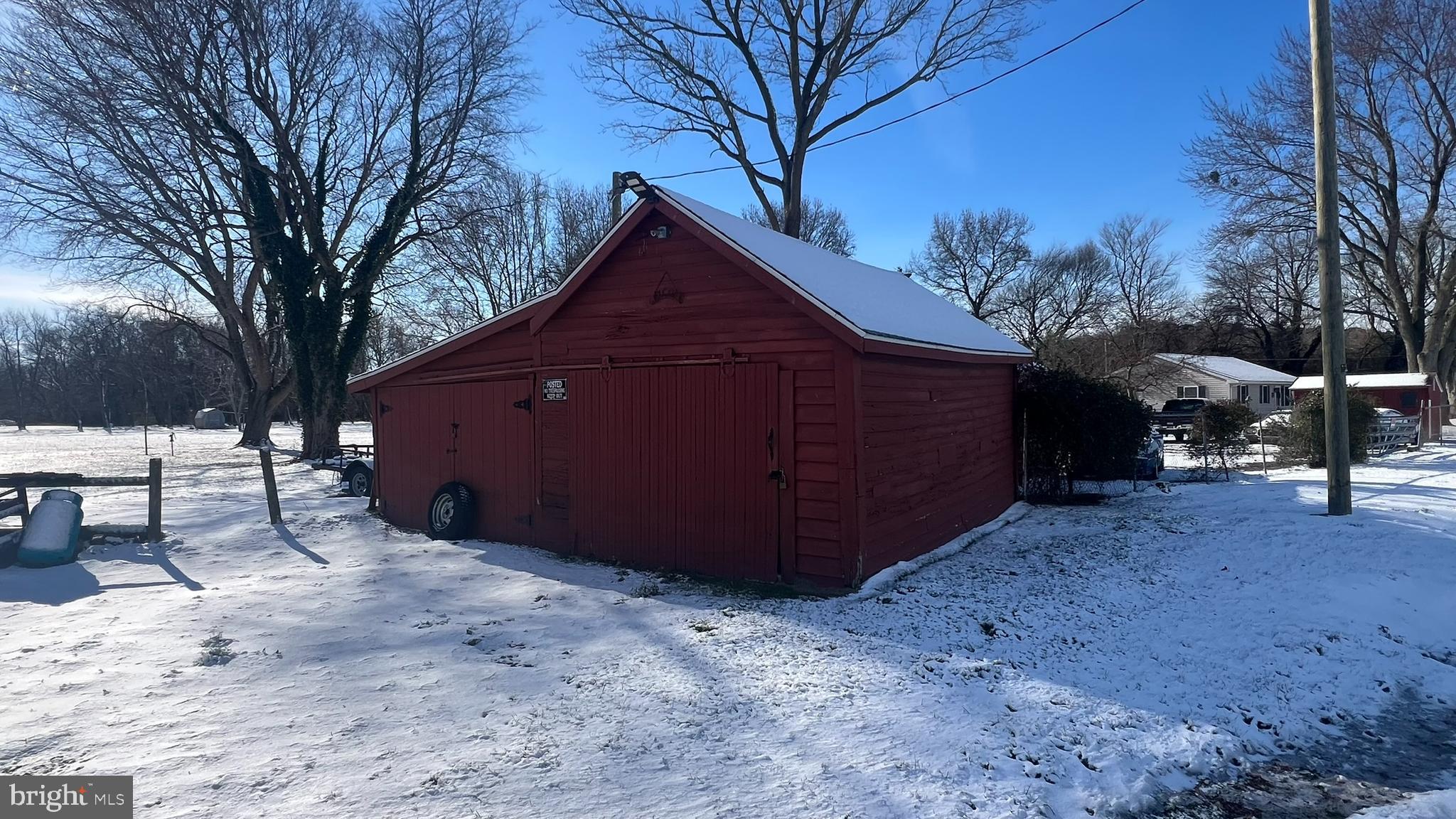 28740 Seaford Road Laurel, DE 19956 - Photo 9 of 44 a view of a wooden house with a yard