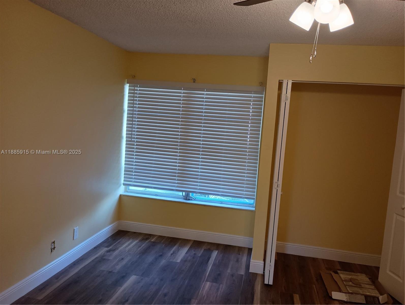 3531 Inverrary Drive, Unit 206 Lauderhill, FL 33319 - Photo 2 of 4 a view of a room with wooden floor and a window