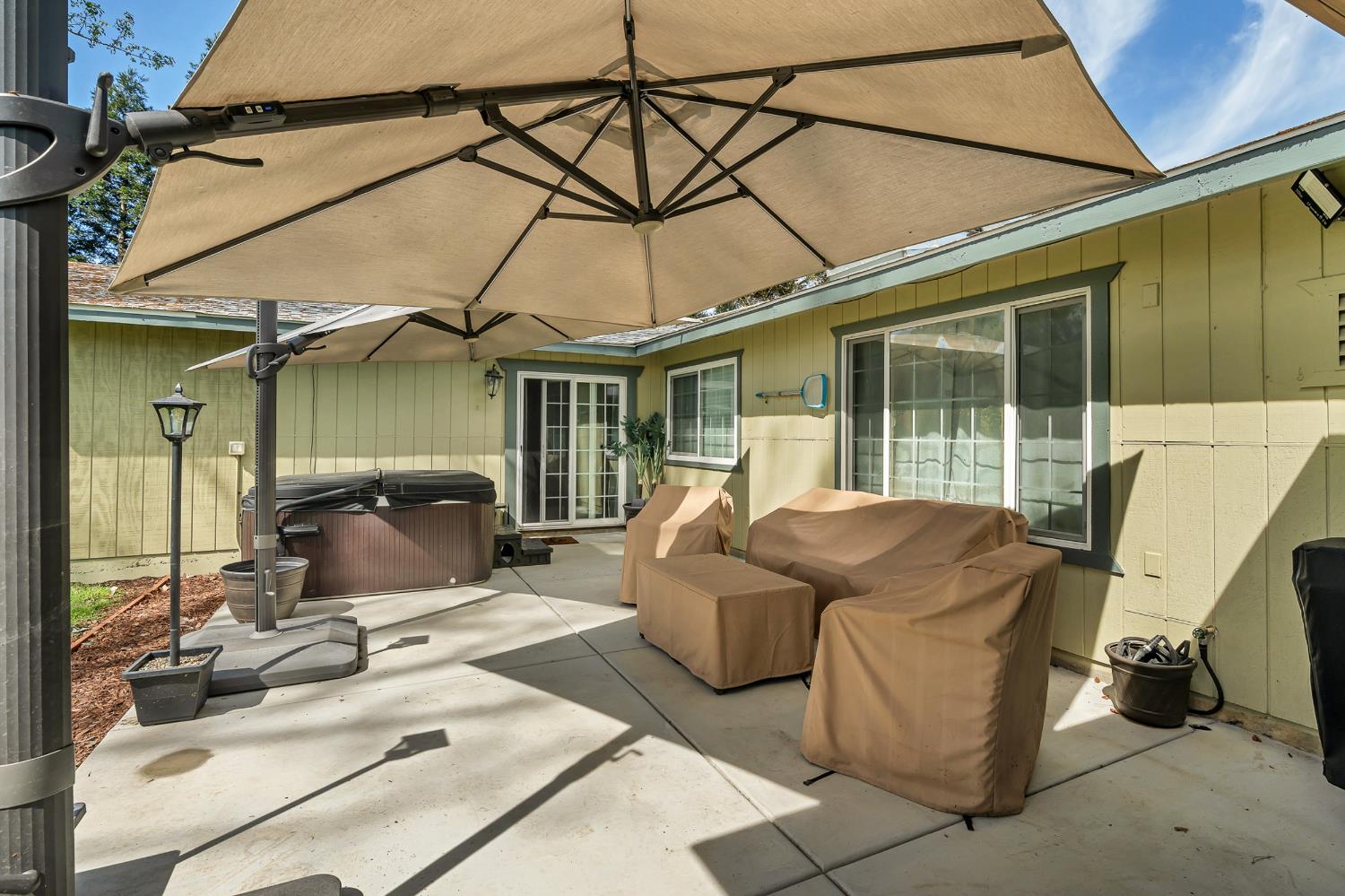 12354 Hobday Road Wilton, CA 95693 - Photo 14 of 77 view of patio / terrace featuring a hot tub