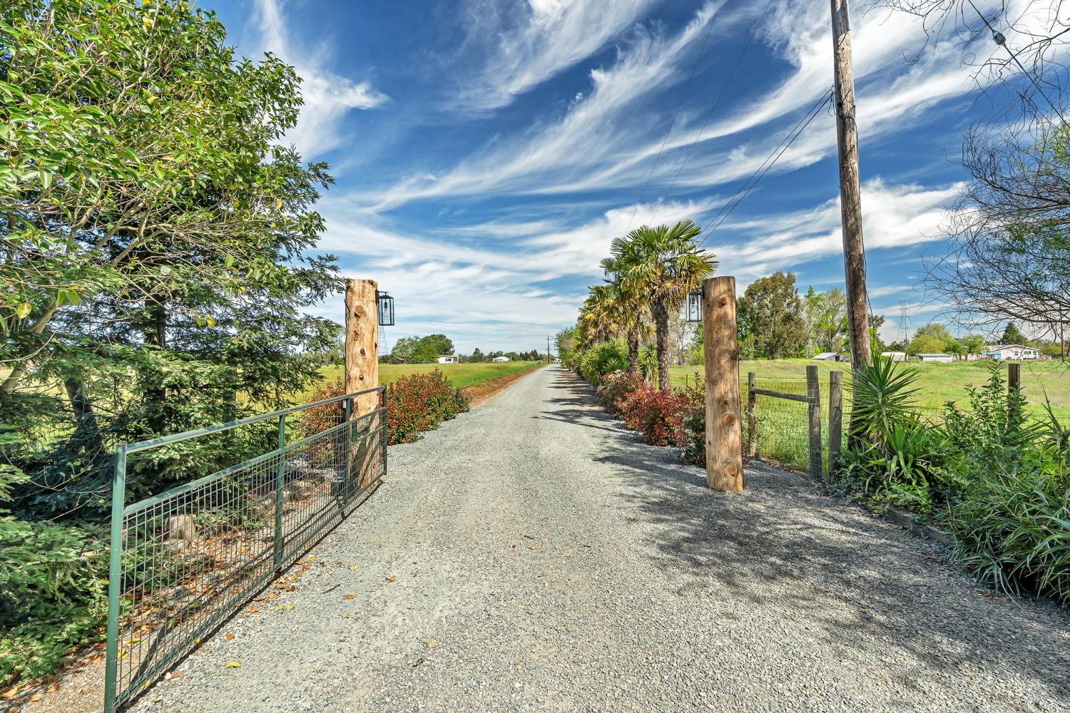 12354 Hobday Road Wilton, CA 95693 - Photo 16 of 77 view of dirt / gravel road featuring a gate