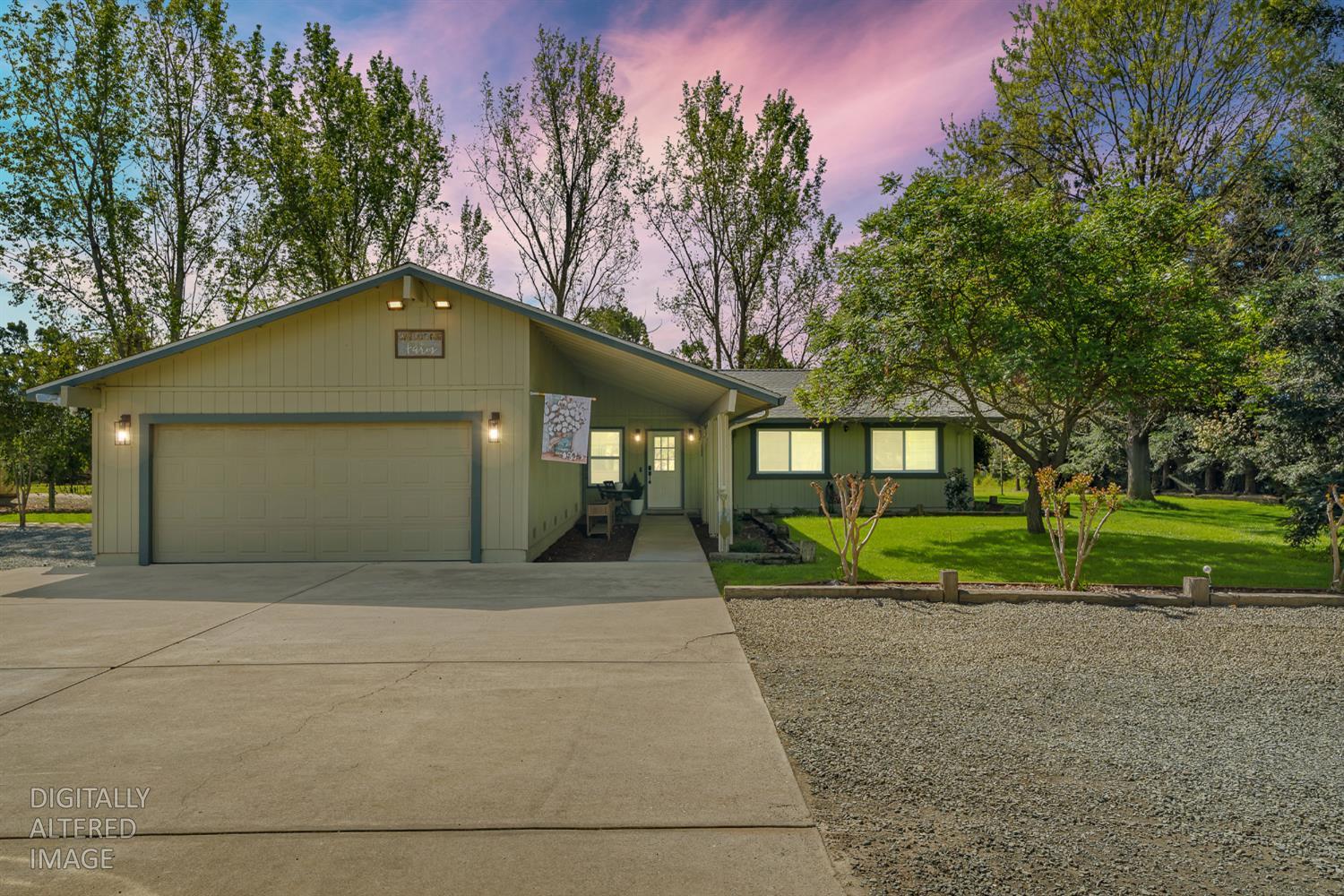 12354 Hobday Road Wilton, CA 95693 - Photo 2 of 77 view of front of home featuring a garage, concrete driveway, and a yard