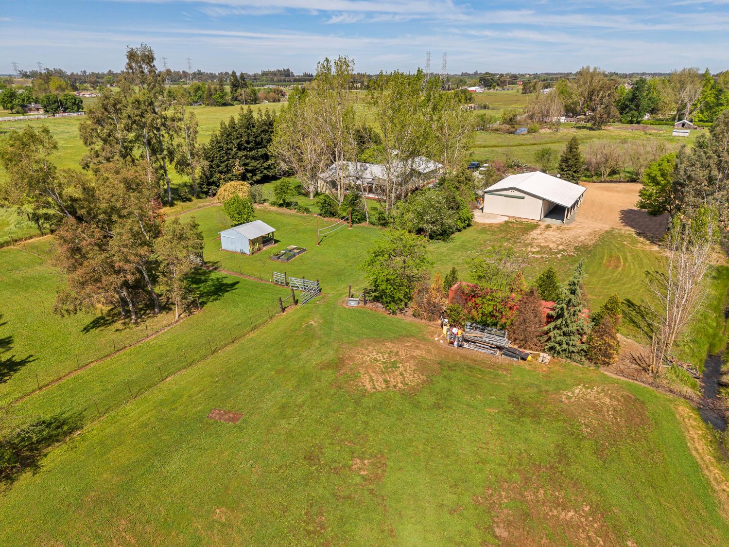 12354 Hobday Road Wilton, CA 95693 - Photo 24 of 77 aerial view of sparsely populated area with a tree filled landscape