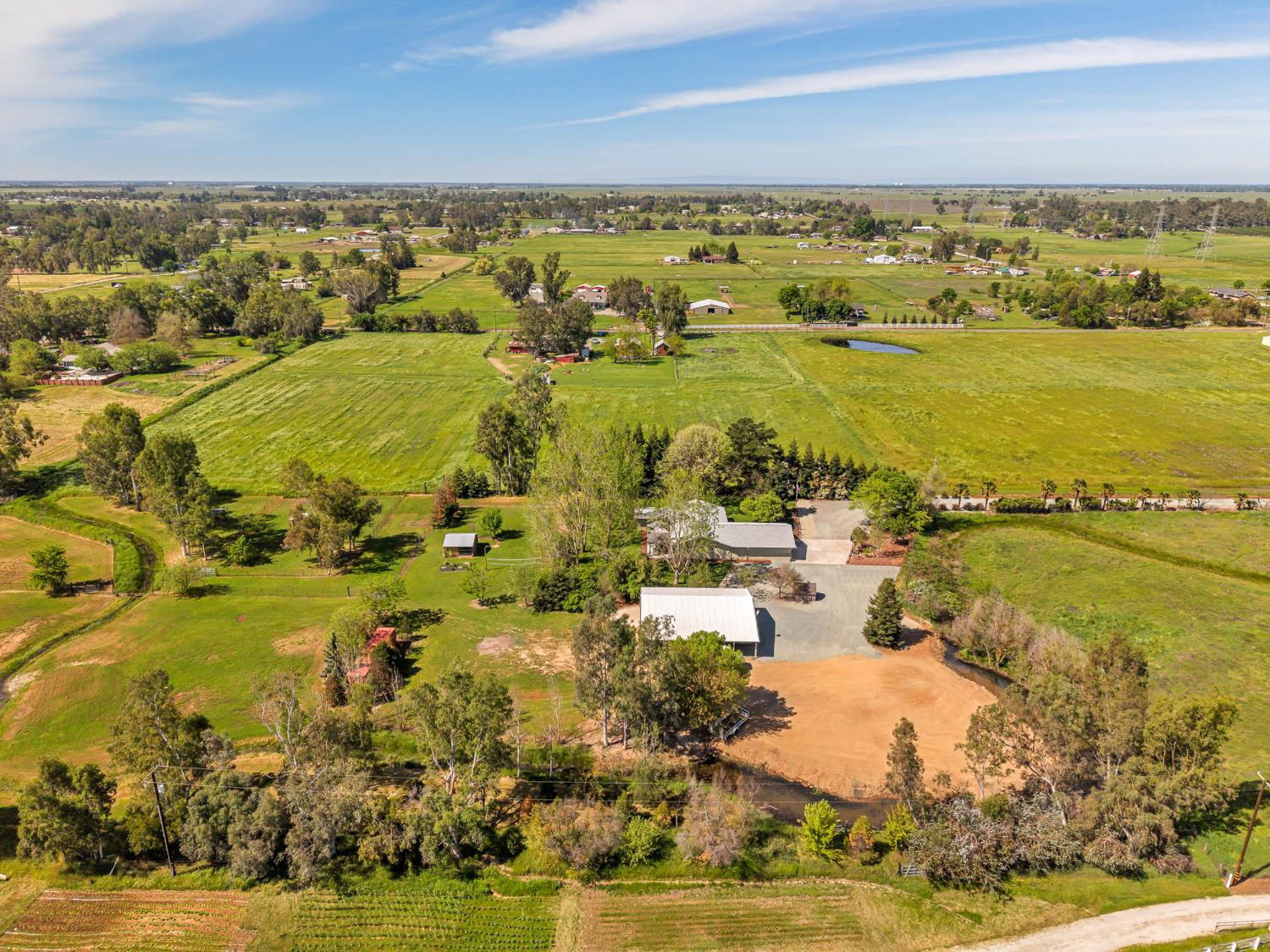 12354 Hobday Road Wilton, CA 95693 - Photo 25 of 77 aerial view of sparsely populated area with rows of crops