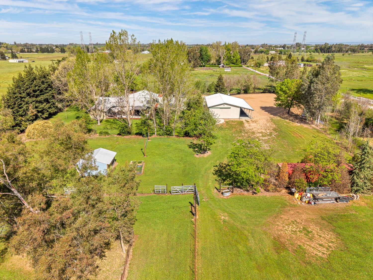 12354 Hobday Road Wilton, CA 95693 - Photo 26 of 77 aerial view of sparsely populated area with a tree filled landscape