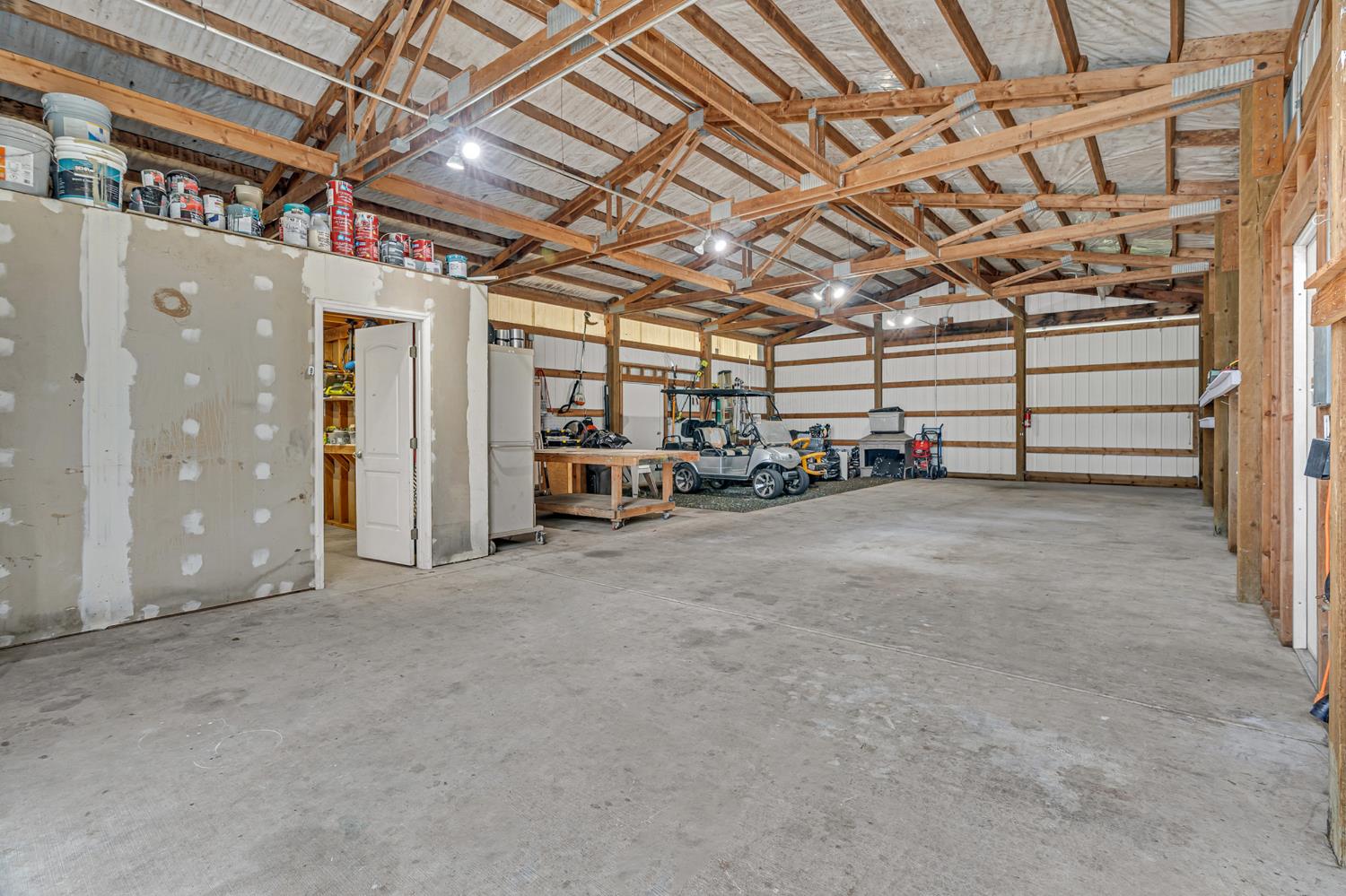 12354 Hobday Road Wilton, CA 95693 - Photo 36 of 77 garage with metal wall