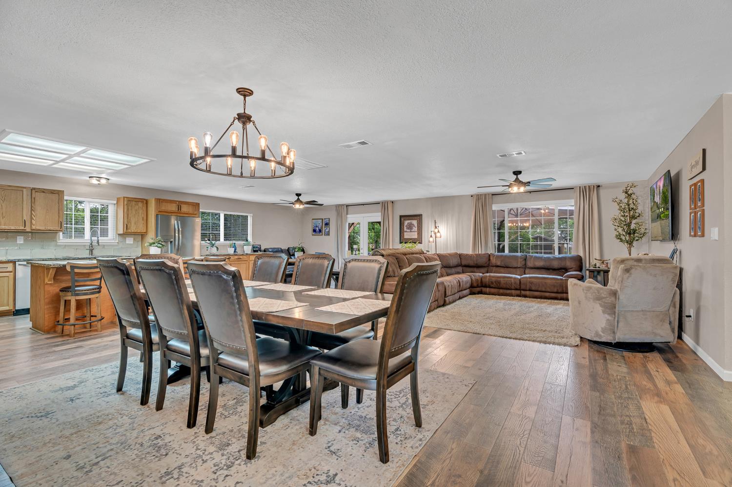 12354 Hobday Road Wilton, CA 95693 - Photo 39 of 77 dining area featuring suspended lighting, a ceiling fan, and light wood-style floors