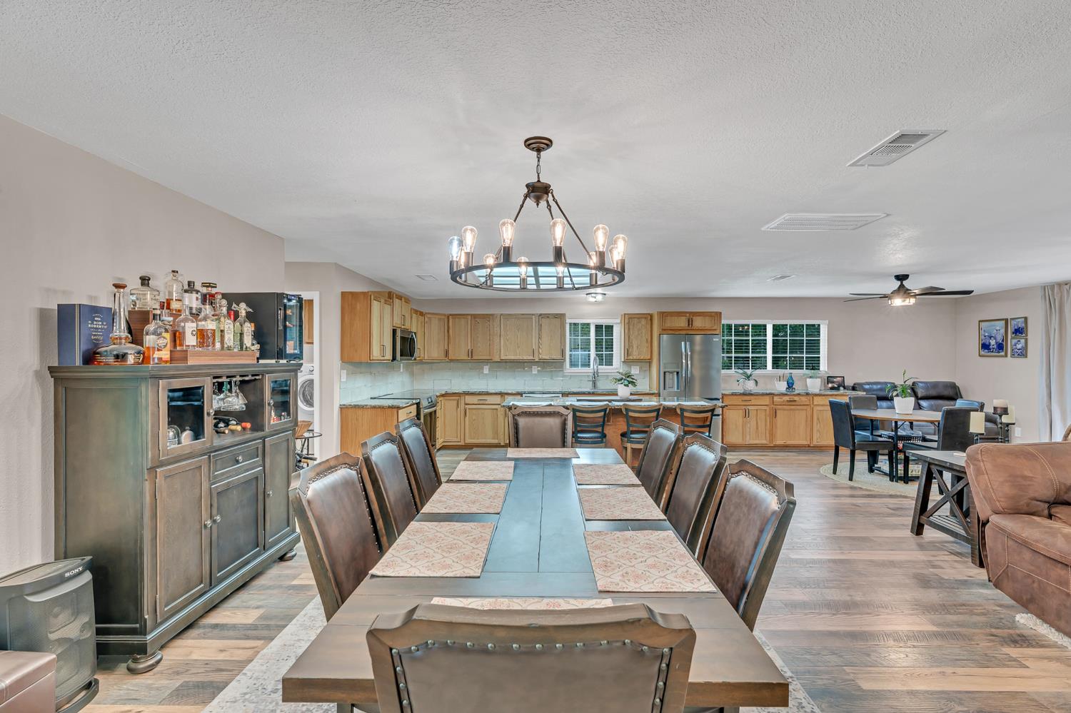 12354 Hobday Road Wilton, CA 95693 - Photo 40 of 77 dining room with hanging lights, dark wood finished floors, and a ceiling fan