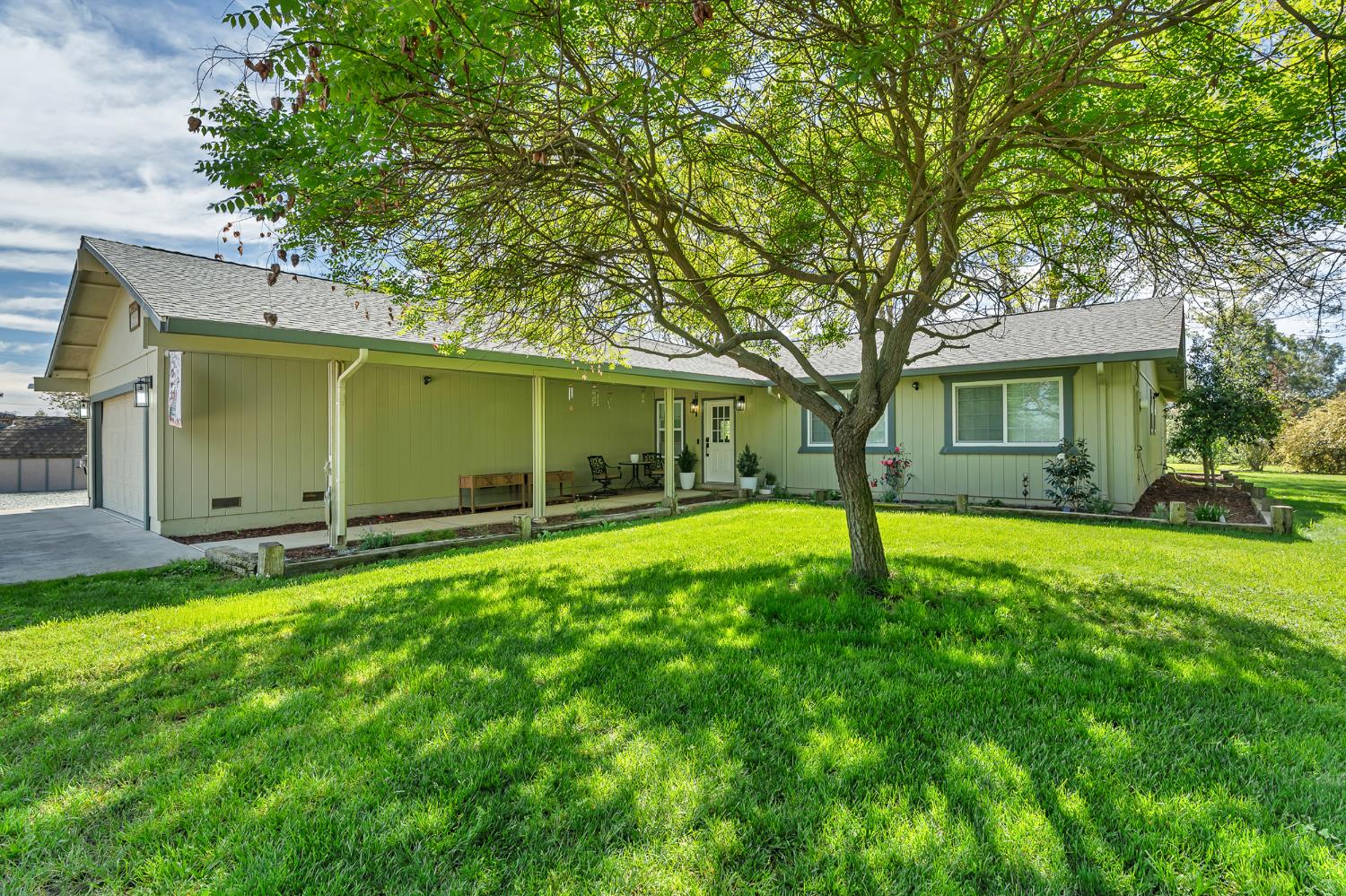 12354 Hobday Road Wilton, CA 95693 - Photo 4 of 77 rear view of house with a shingled roof, a garage, and a lawn