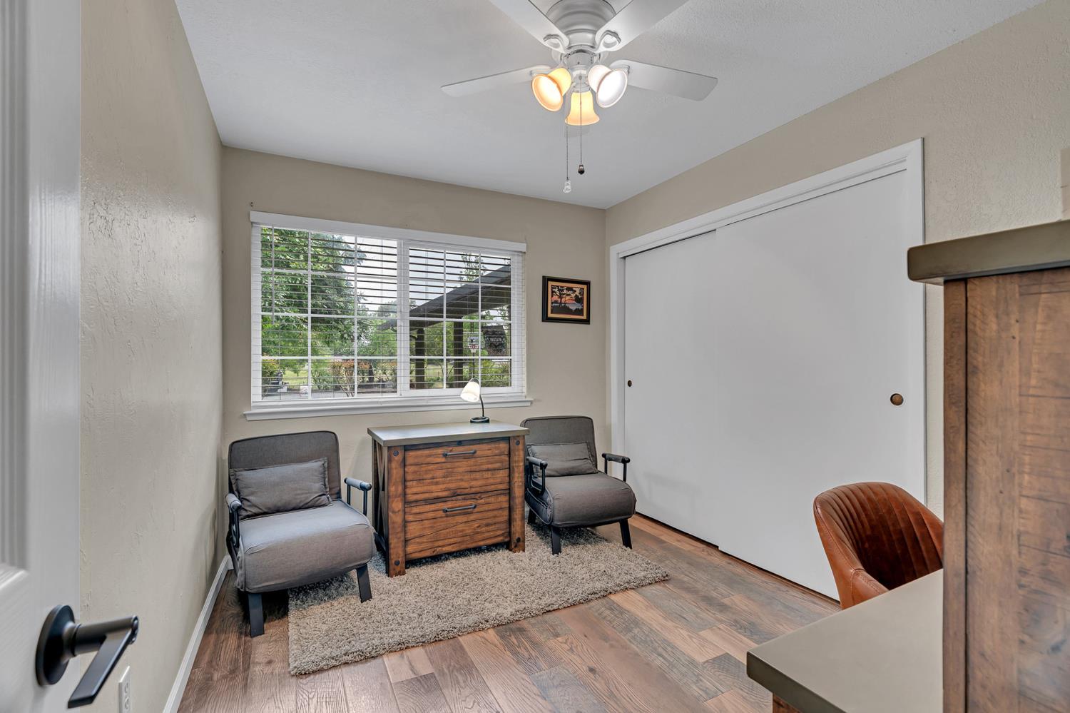 12354 Hobday Road Wilton, CA 95693 - Photo 51 of 77 office with light wood-type flooring, ceiling fan, and a textured wall